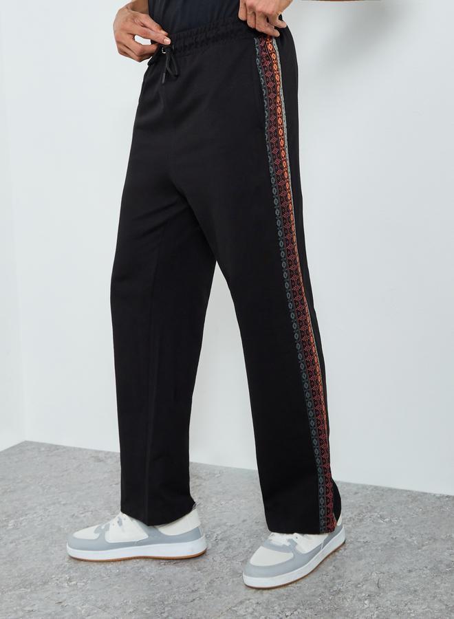 Styli Men Black Oversized Terry Printed Panel Joggers - Image 1